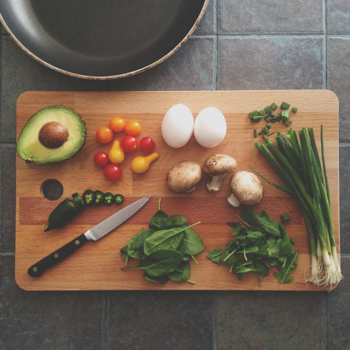 Prep board with a knife and fresh ingredients