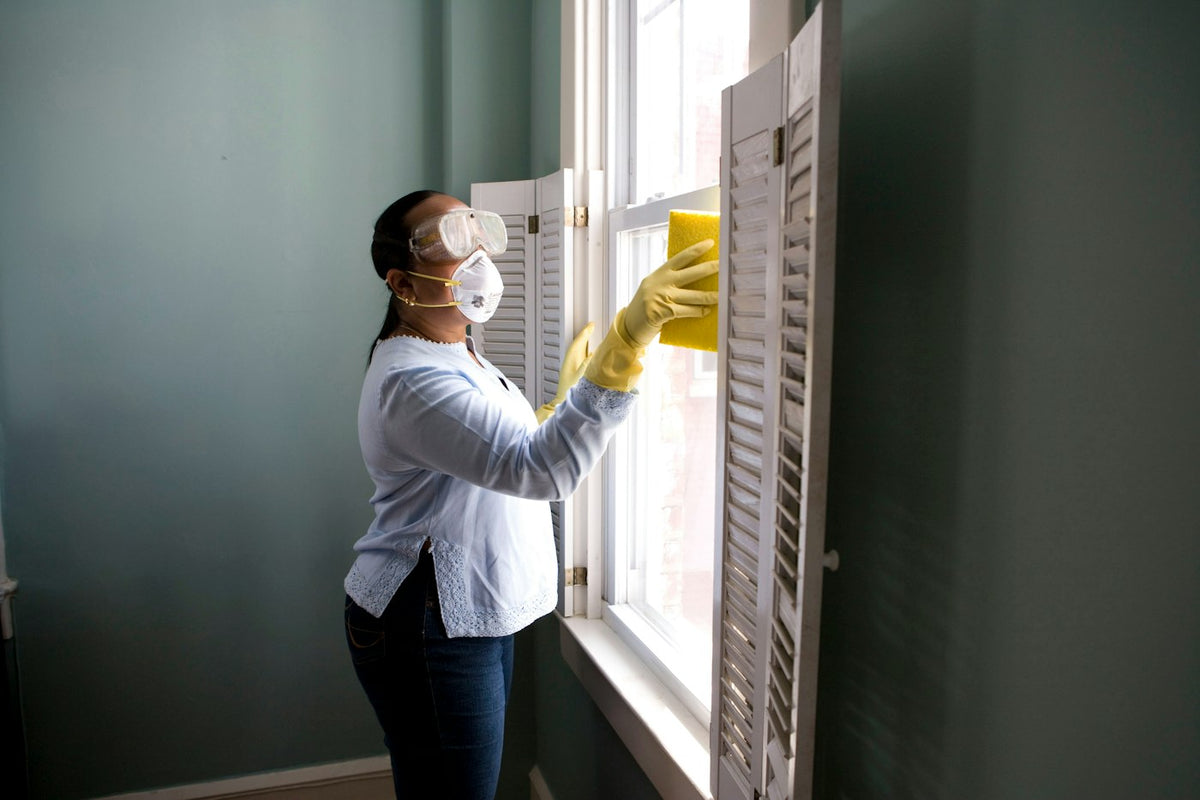 Cleaning in progress with gloves and supplies